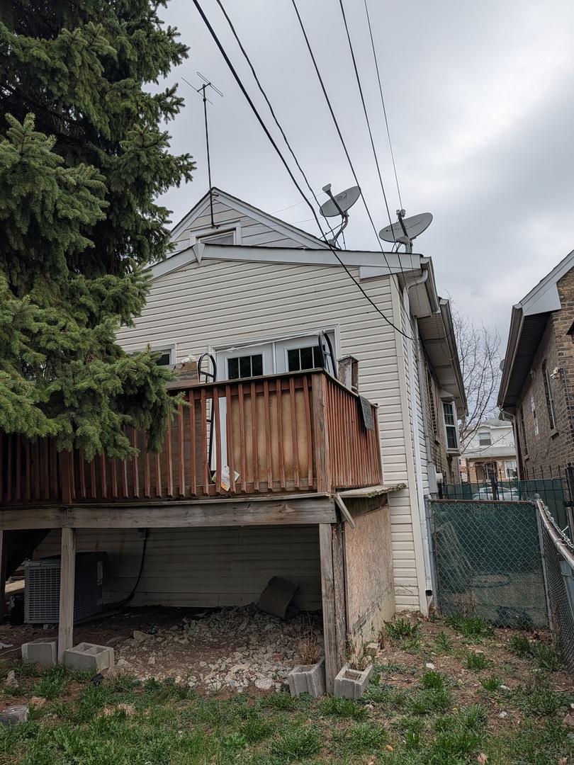 5041 West George Street Chicago, IL 60641 - Photo 4 of 11 a view of backyard with deck