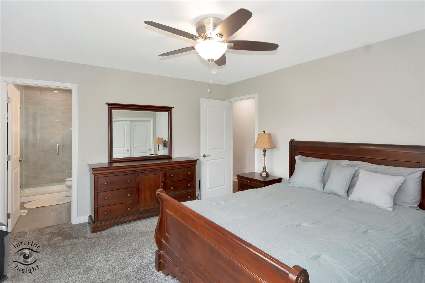 520 Hackberry Road Frankfort, IL 60423 - Photo 13 of 28 a bedroom with a bed and a chandelier