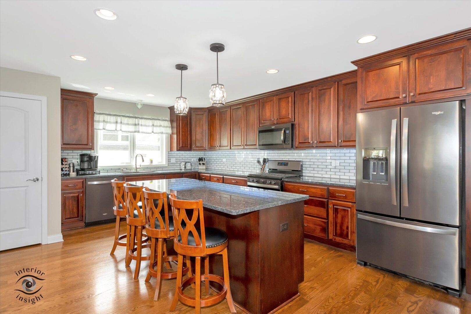 520 Hackberry Road Frankfort, IL 60423 - Photo 8 of 28 a kitchen with stainless steel appliances granite countertop a refrigerator a sink dishwasher a stove and a refrigerator with wooden floor