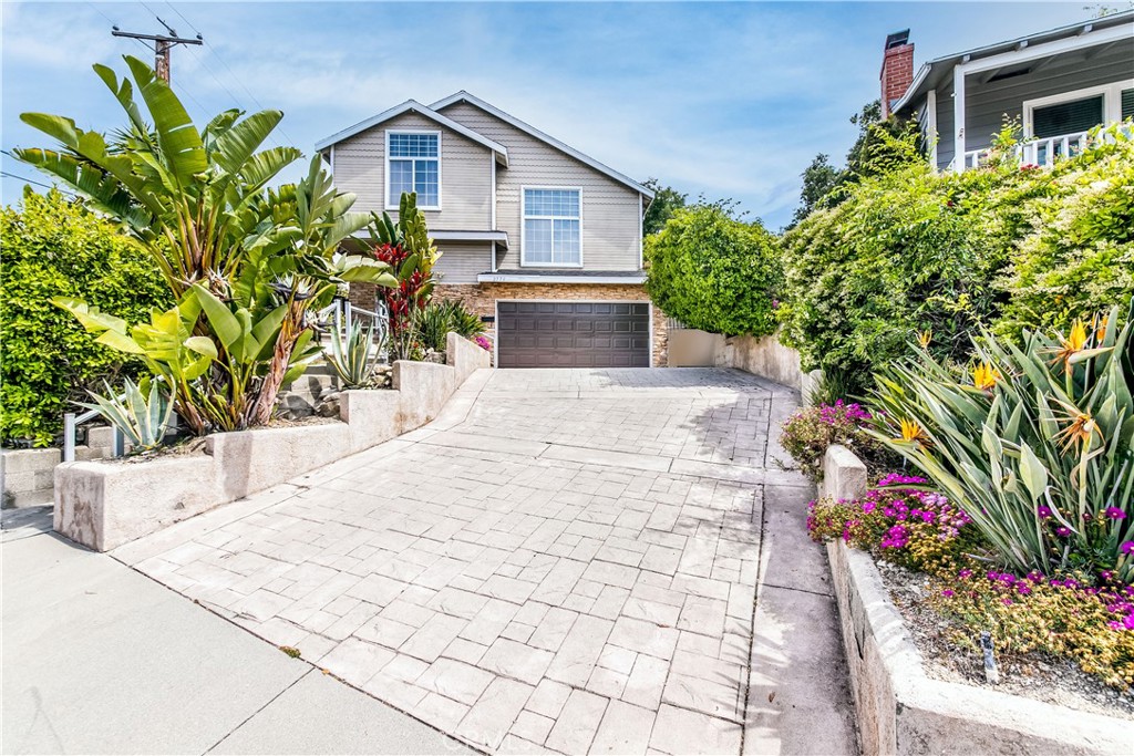 2771 Community Avenue La Crescenta, CA 91214 - Photo 1 of 37 a potted plant sitting in front of a house