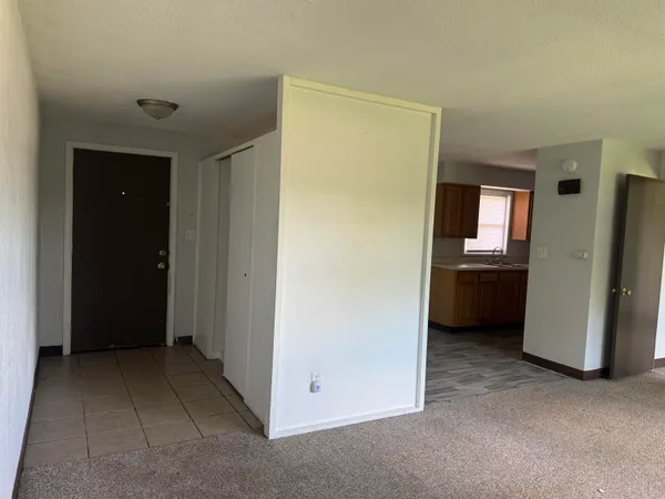 a view of an empty room with a window