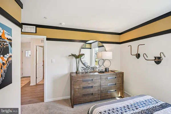 a bedroom with a bed and a table in it