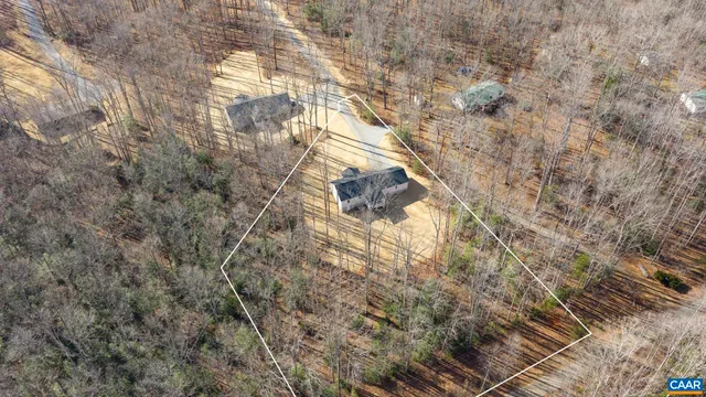a view of a kitchen with stainless steel appliances wooden floor and a large window