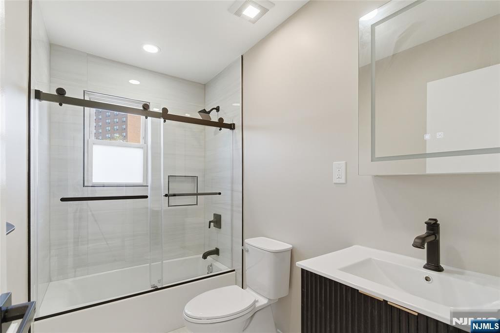 293 North Center Street, Unit 2 Orange, NJ 07050 - Photo 13 of 25 a bathroom with a sink toilet and shower