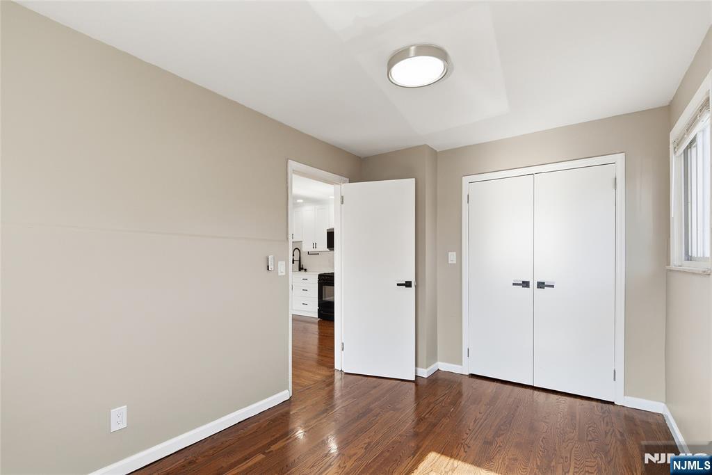 293 North Center Street, Unit 2 Orange, NJ 07050 - Photo 15 of 25 a view of an empty room with wooden floor