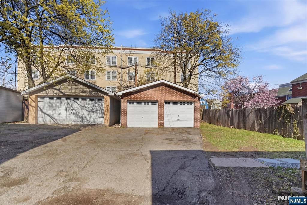 293 North Center Street, Unit 2 Orange, NJ 07050 - Photo 5 of 25 a view of a house with a yard