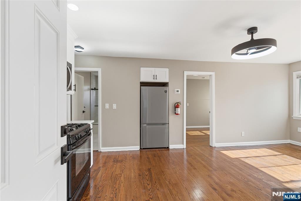 293 North Center Street, Unit 2 Orange, NJ 07050 - Photo 6 of 25 a view of empty room with wooden floor