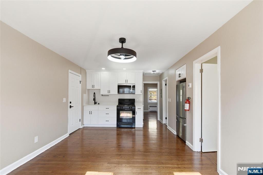 293 North Center Street, Unit 2 Orange, NJ 07050 - Photo 8 of 25 a view of a livingroom with a kitchen