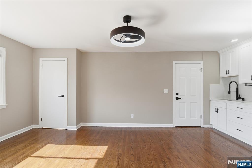 293 North Center Street, Unit 2 Orange, NJ 07050 - Photo 9 of 25 a view of a hardwood floor in a room