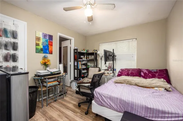 a bedroom with a bed furniture and decor