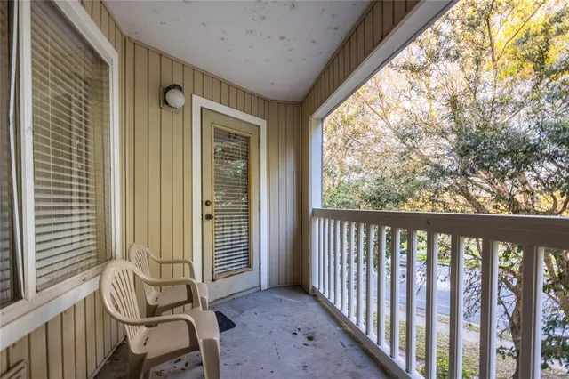 a view of a porch with chairs