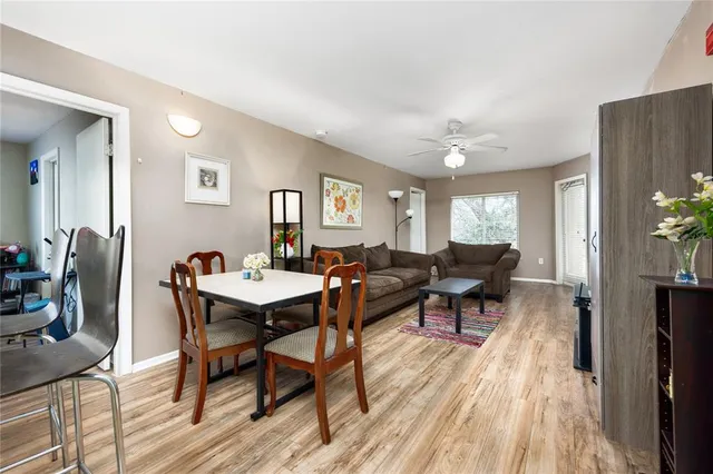 a view of a dining room with furniture window and wooden floor