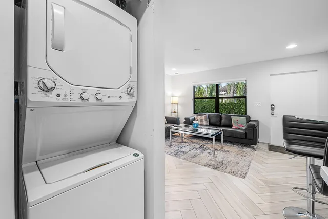 a kitchen with stainless steel appliances a white stove top oven and a refrigerator