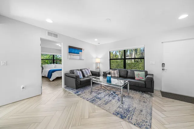 a living room with furniture and a table