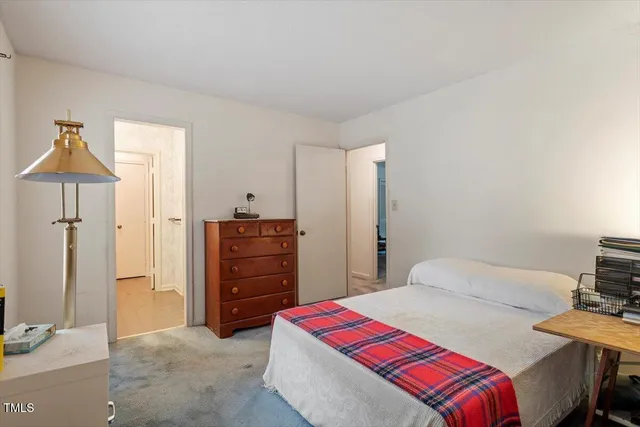 a bedroom with a bed and a furniture