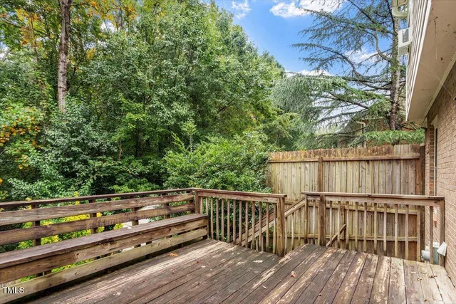 a view of a wooden bench in a yard