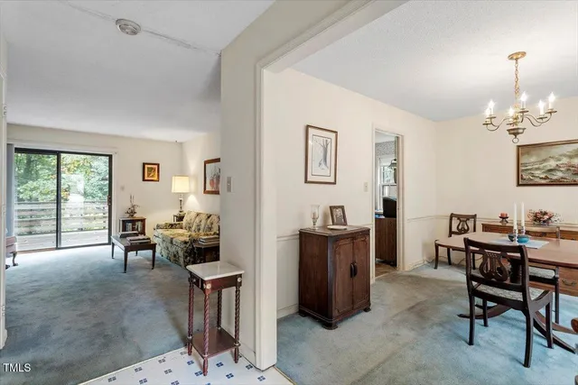 a view of a livingroom with furniture and a window