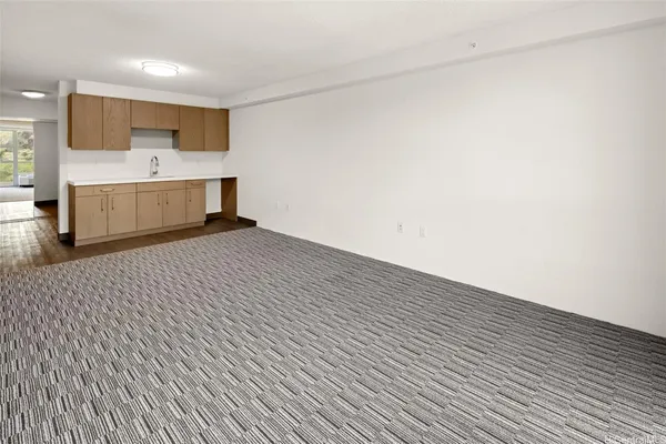 a view of a kitchen with microwave and cabinets