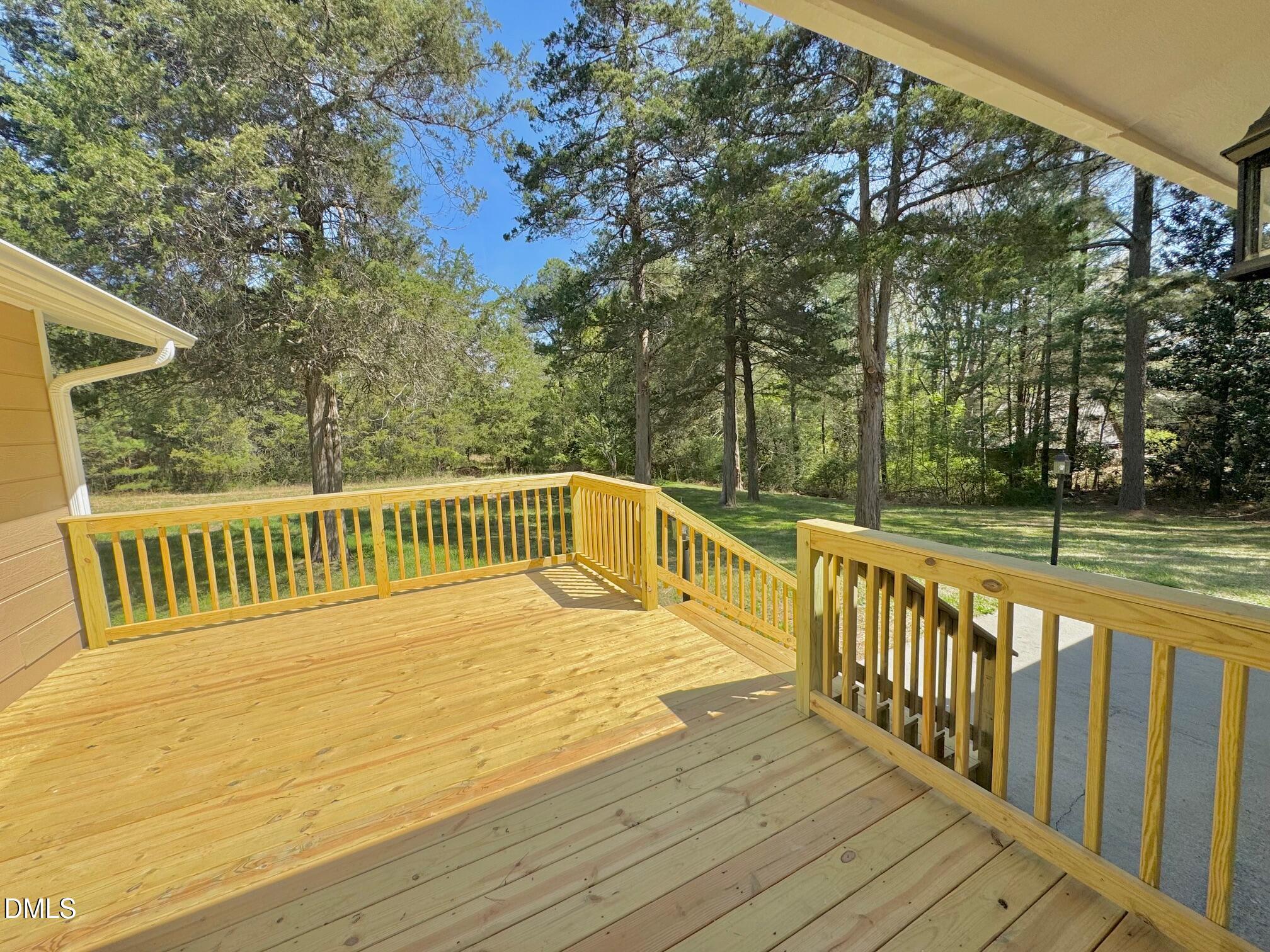 1720 Ross Mill Road Henderson, NC 27537 - Photo 32 of 42 a view of balcony with wooden floor and fence