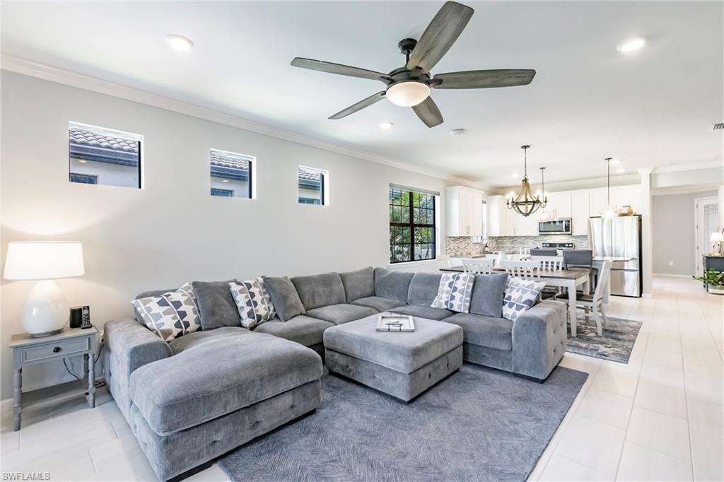 16637 Rolling Rock Boulevard Alva, FL 33920 - Photo 14 of 46 a living room with furniture kitchen view and a window