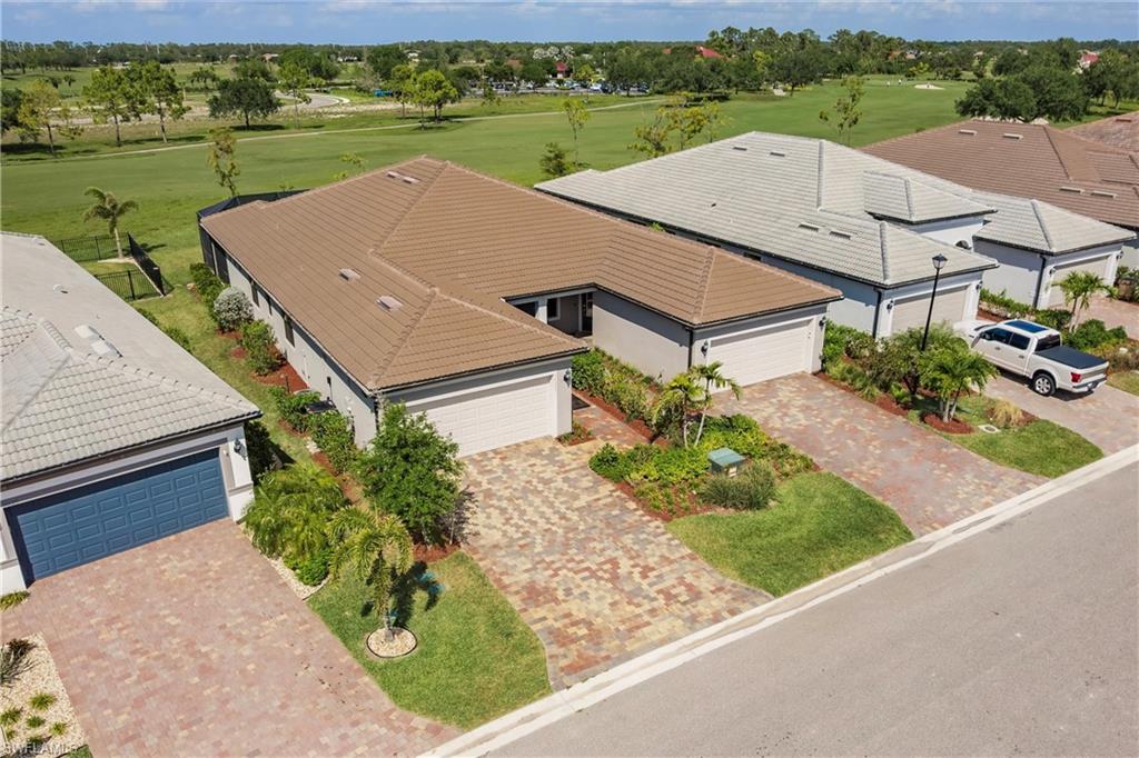 16637 Rolling Rock Boulevard Alva, FL 33920 - Photo 2 of 46 an aerial view of a house with a garden and lake view