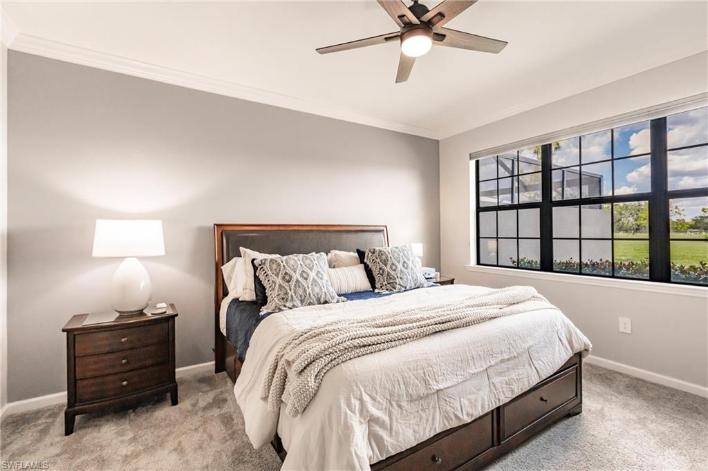 16637 Rolling Rock Boulevard Alva, FL 33920 - Photo 21 of 46 a bedroom with a bed and window