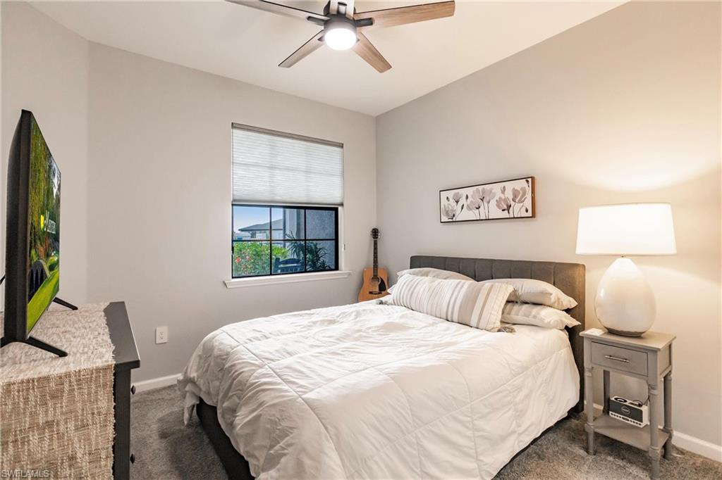 16637 Rolling Rock Boulevard Alva, FL 33920 - Photo 23 of 46 a bedroom with a bed and a window