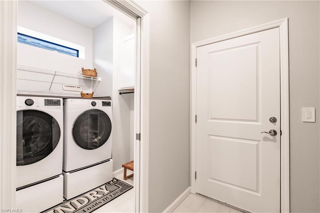 16637 Rolling Rock Boulevard Alva, FL 33920 - Photo 25 of 46 a utility room with dryer and washer
