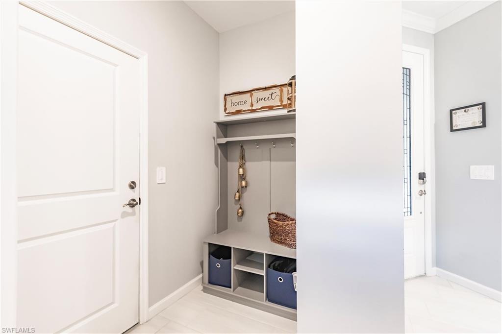 16637 Rolling Rock Boulevard Alva, FL 33920 - Photo 26 of 46 a room with a closet and mirror