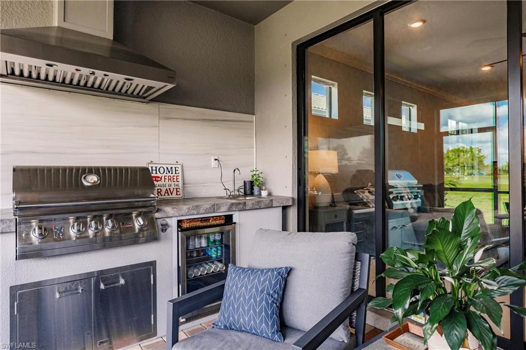 16637 Rolling Rock Boulevard Alva, FL 33920 - Photo 34 of 46 a kitchen with stove and cabinets