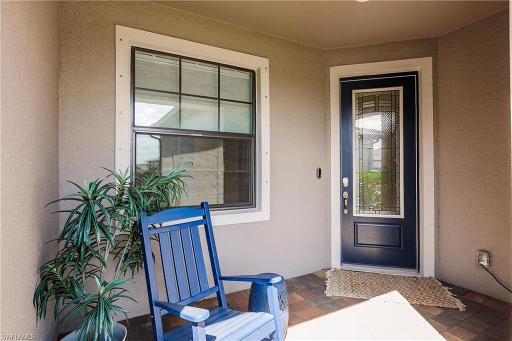 16637 Rolling Rock Boulevard Alva, FL 33920 - Photo 4 of 46 a view of an entryway with wooden floor