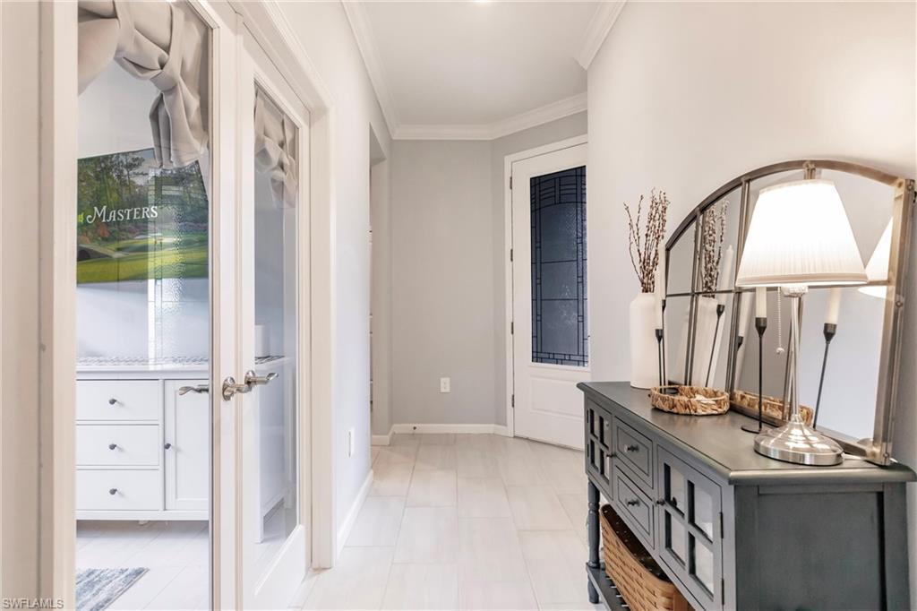 16637 Rolling Rock Boulevard Alva, FL 33920 - Photo 8 of 46 a bathroom with a double vanity sink and a mirror