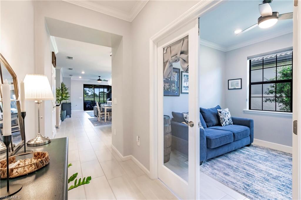 16637 Rolling Rock Boulevard Alva, FL 33920 - Photo 9 of 46 a living room with furniture and windows