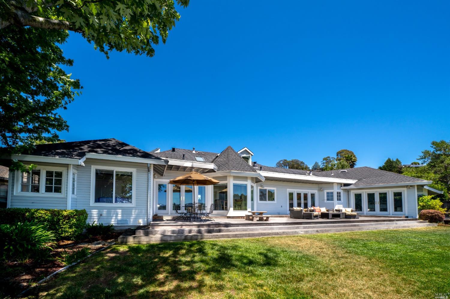 5 Bay Court San Rafael, CA 94901 - Photo 1 of 1 a front view of a house with a yard table and chairs