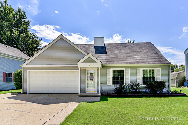 16 Pembrooke Road Montgomery, IL 60538 - Photo 1 of 16 a front view of a house with a yard and garage