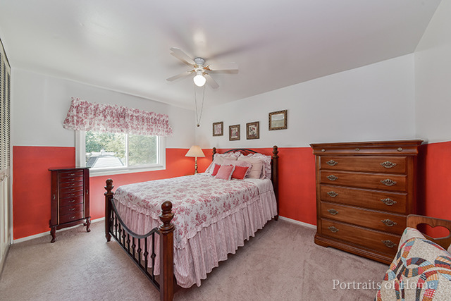 16 Pembrooke Road Montgomery, IL 60538 - Photo 12 of 16 a bed room with a bed and a window