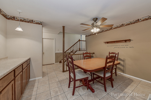 16 Pembrooke Road Montgomery, IL 60538 - Photo 5 of 16 a dining room with furniture and a chandelier fan
