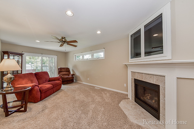 16 Pembrooke Road Montgomery, IL 60538 - Photo 7 of 16 a living room with furniture and a fireplace