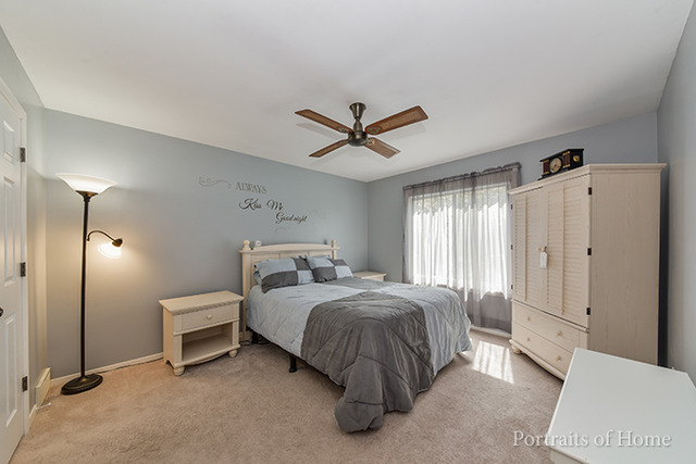 16 Pembrooke Road Montgomery, IL 60538 - Photo 9 of 16 a bed room with a bed and a ceiling fan