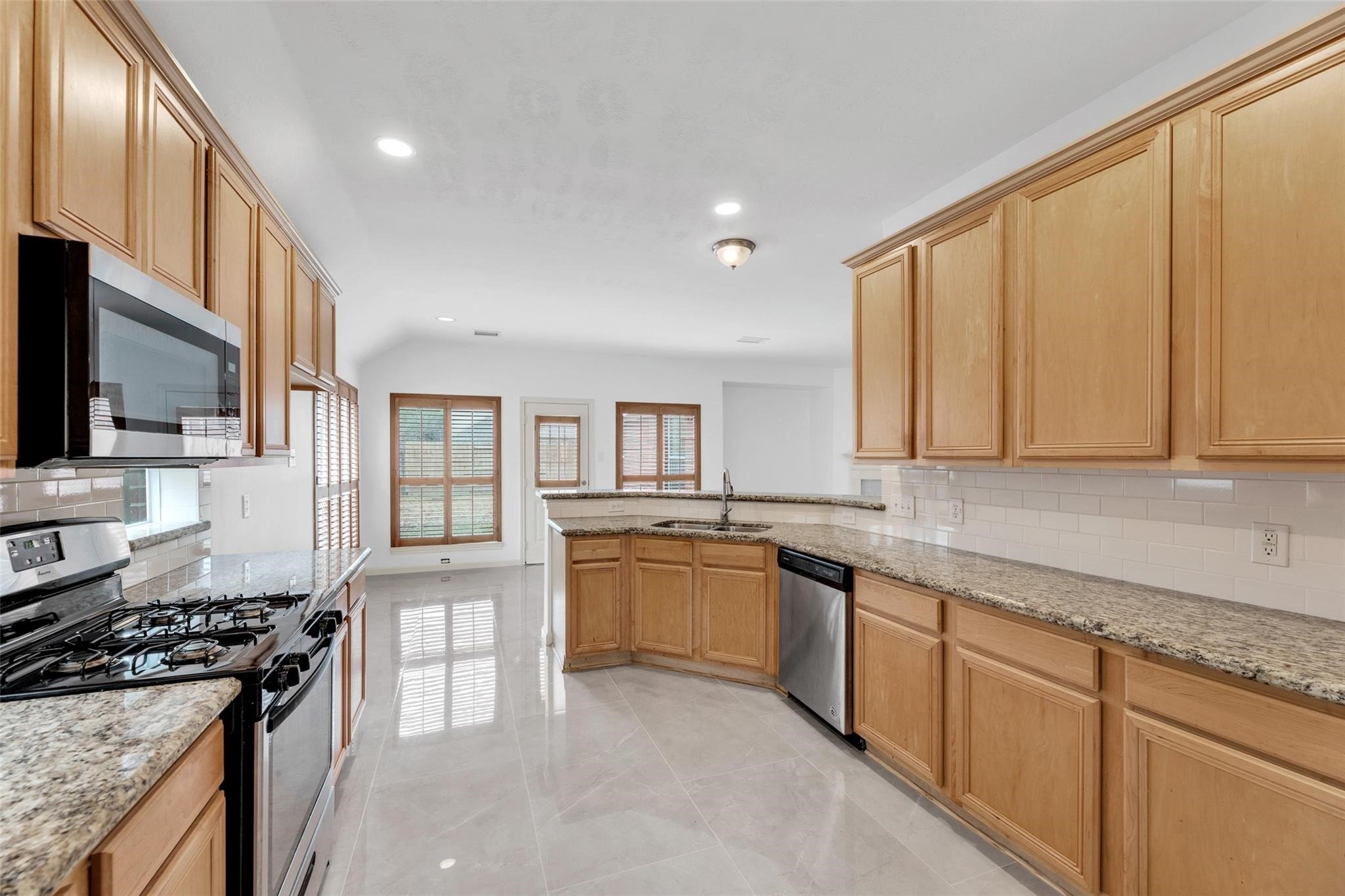 24523 Rathford Court Katy, TX 77494 - Photo 12 of 33 Open kitchen with ample counter space, great for cooking and entertaining.