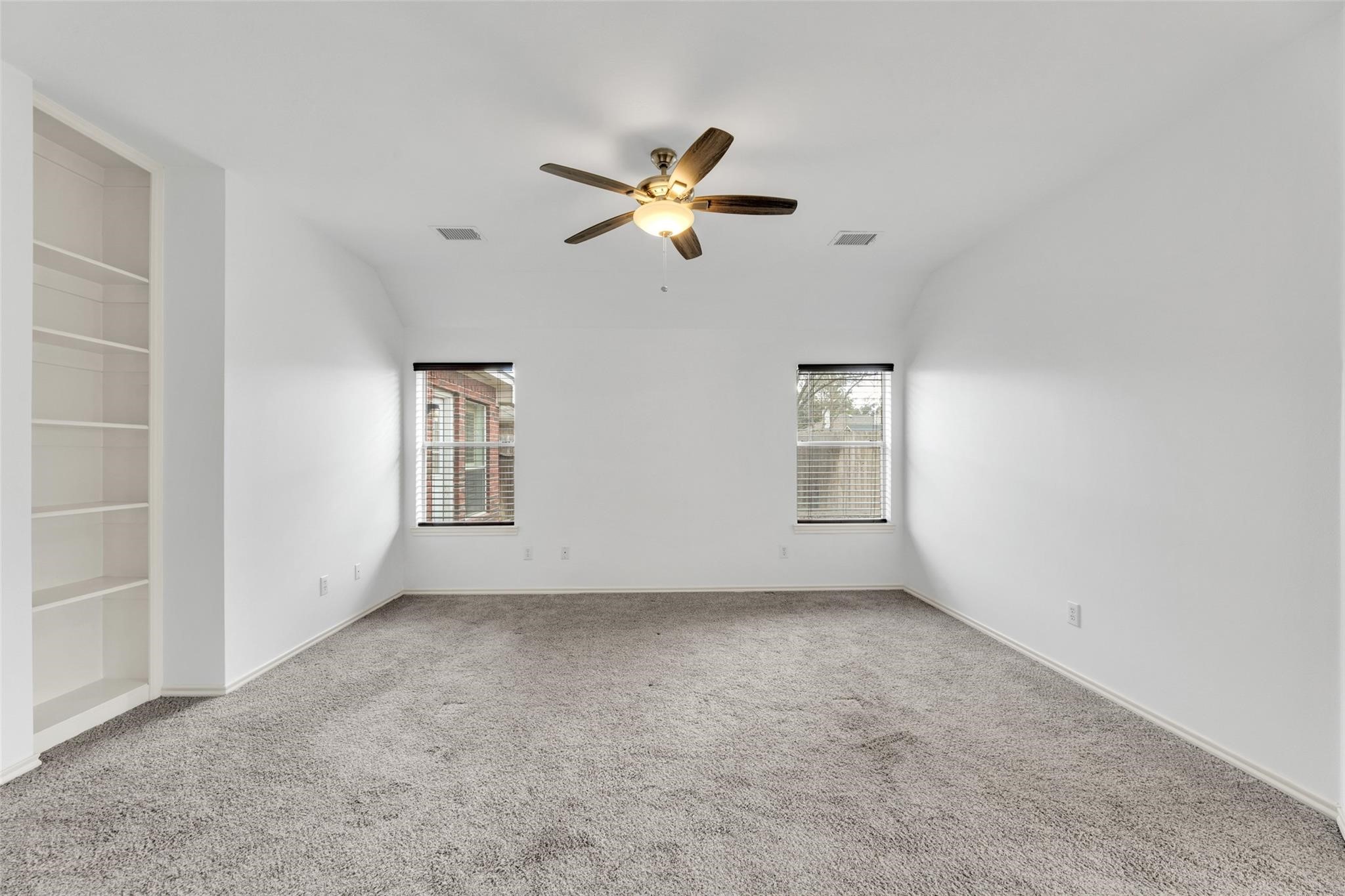 24523 Rathford Court Katy, TX 77494 - Photo 27 of 33 Well-sized bedroom with ample space for furniture and storage.