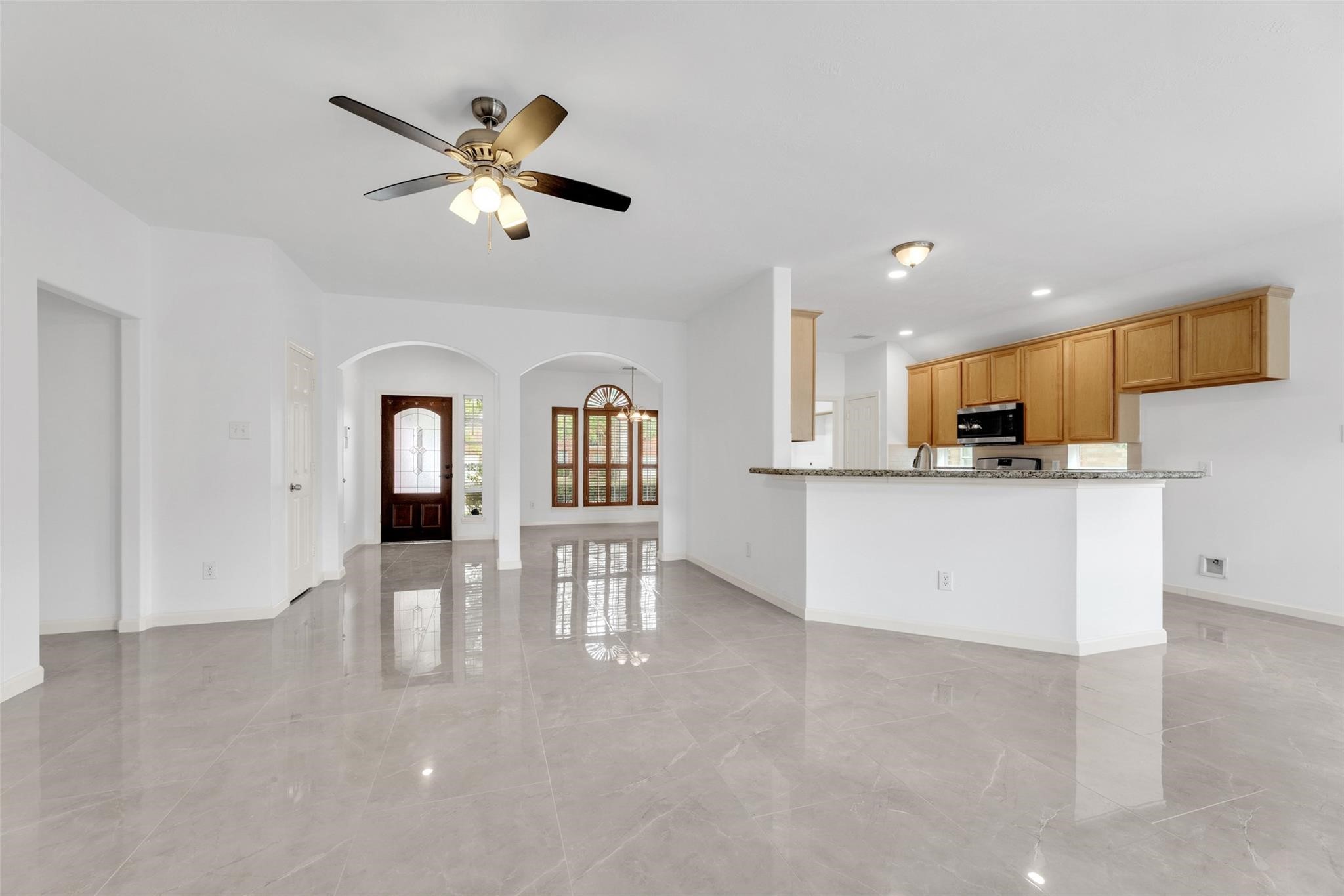 24523 Rathford Court Katy, TX 77494 - Photo 7 of 33 Well-appointed kitchen featuring plenty of storage and a layout that connects seamlessly to the breakfast nook and living room.