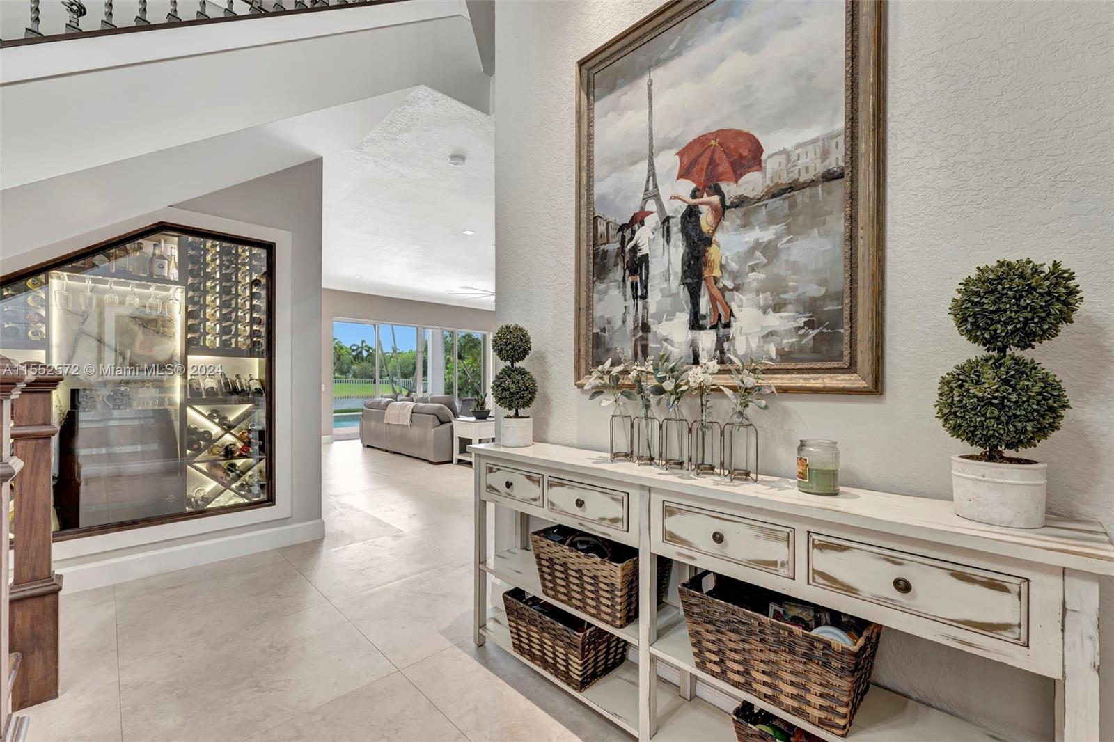 809 Regal Cove Road Weston, FL 33327 - Photo 19 of 70 a bathroom with a sink a mirror and a window