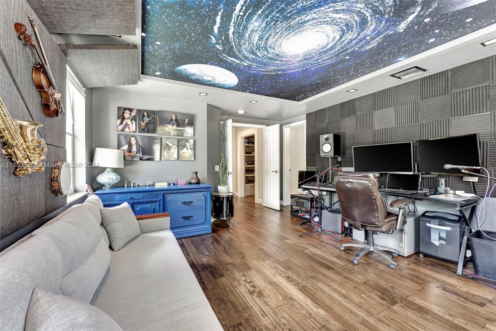 809 Regal Cove Road Weston, FL 33327 - Photo 21 of 70 a living room with furniture and a flat screen tv