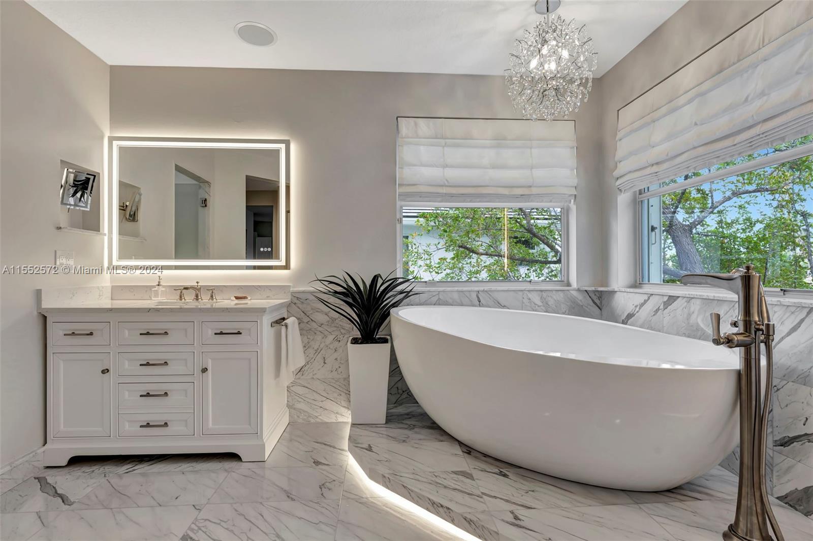 809 Regal Cove Road Weston, FL 33327 - Photo 28 of 70 a view of a bathtub in a room