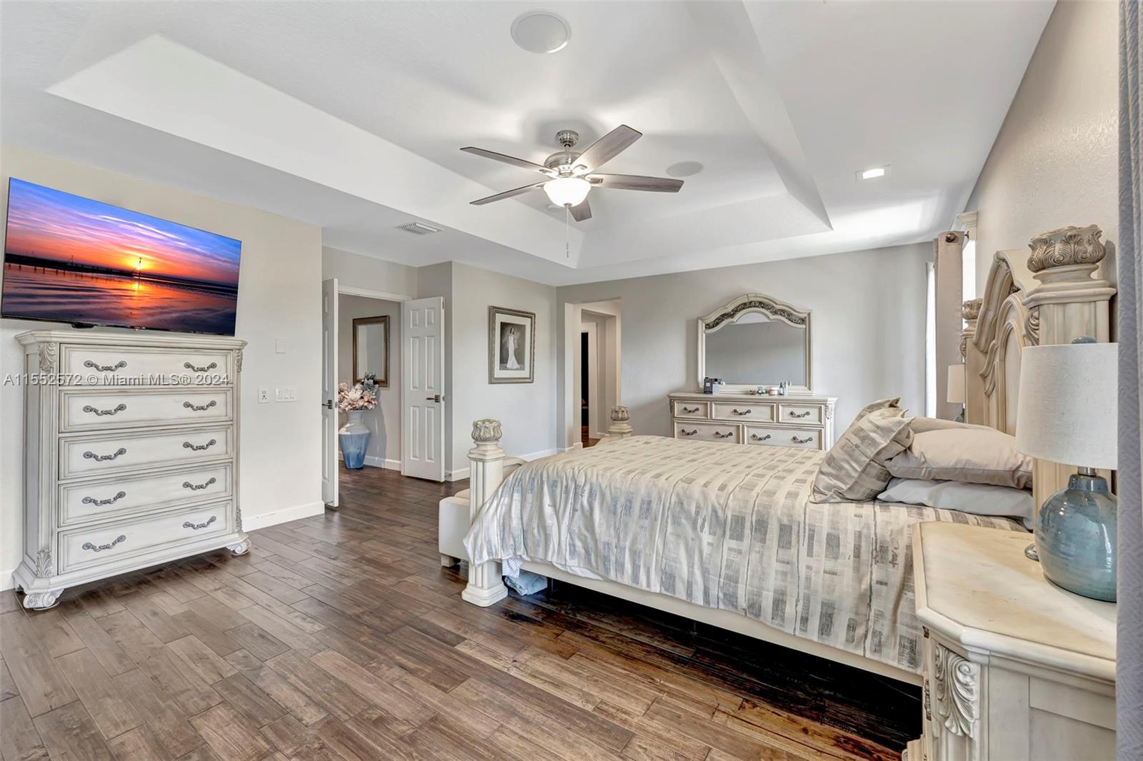 809 Regal Cove Road Weston, FL 33327 - Photo 31 of 70 a bedroom with a bed and a dresser