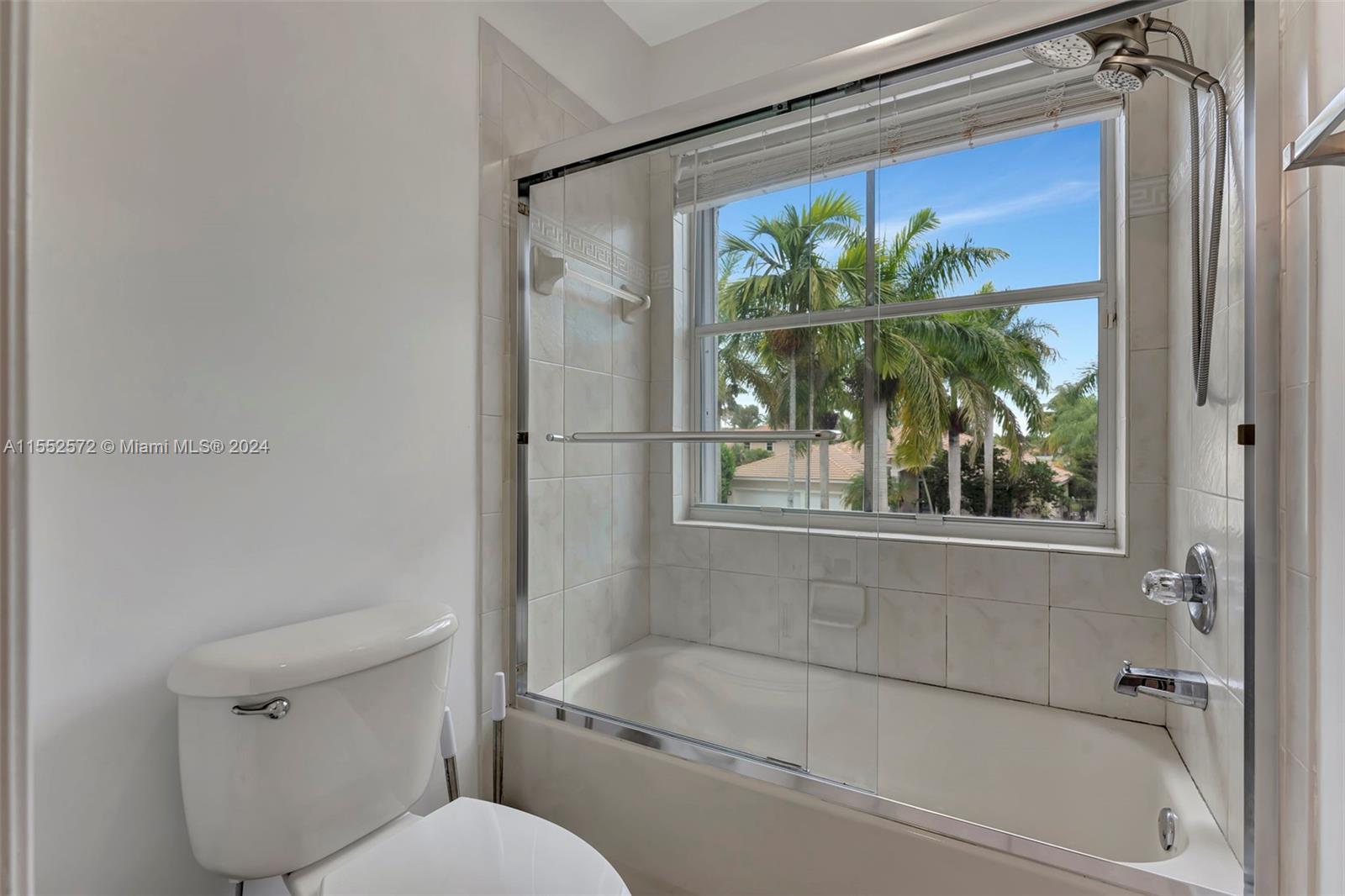 809 Regal Cove Road Weston, FL 33327 - Photo 36 of 70 a bathroom with a shower and a toilet