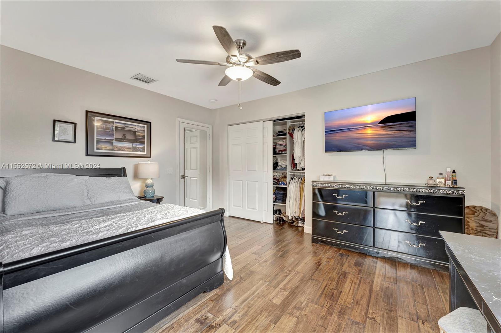 809 Regal Cove Road Weston, FL 33327 - Photo 37 of 70 a living room with furniture and a flat screen tv