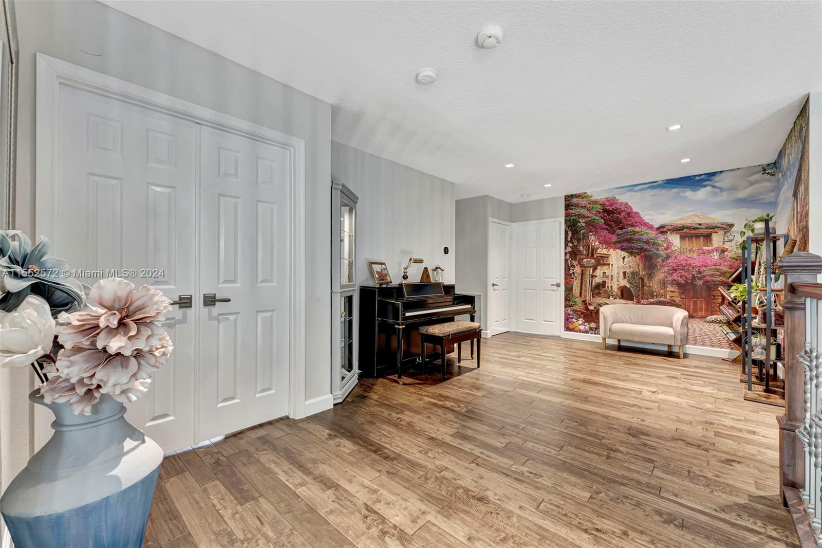 809 Regal Cove Road Weston, FL 33327 - Photo 43 of 70 a spacious bedroom with a bed and a couch