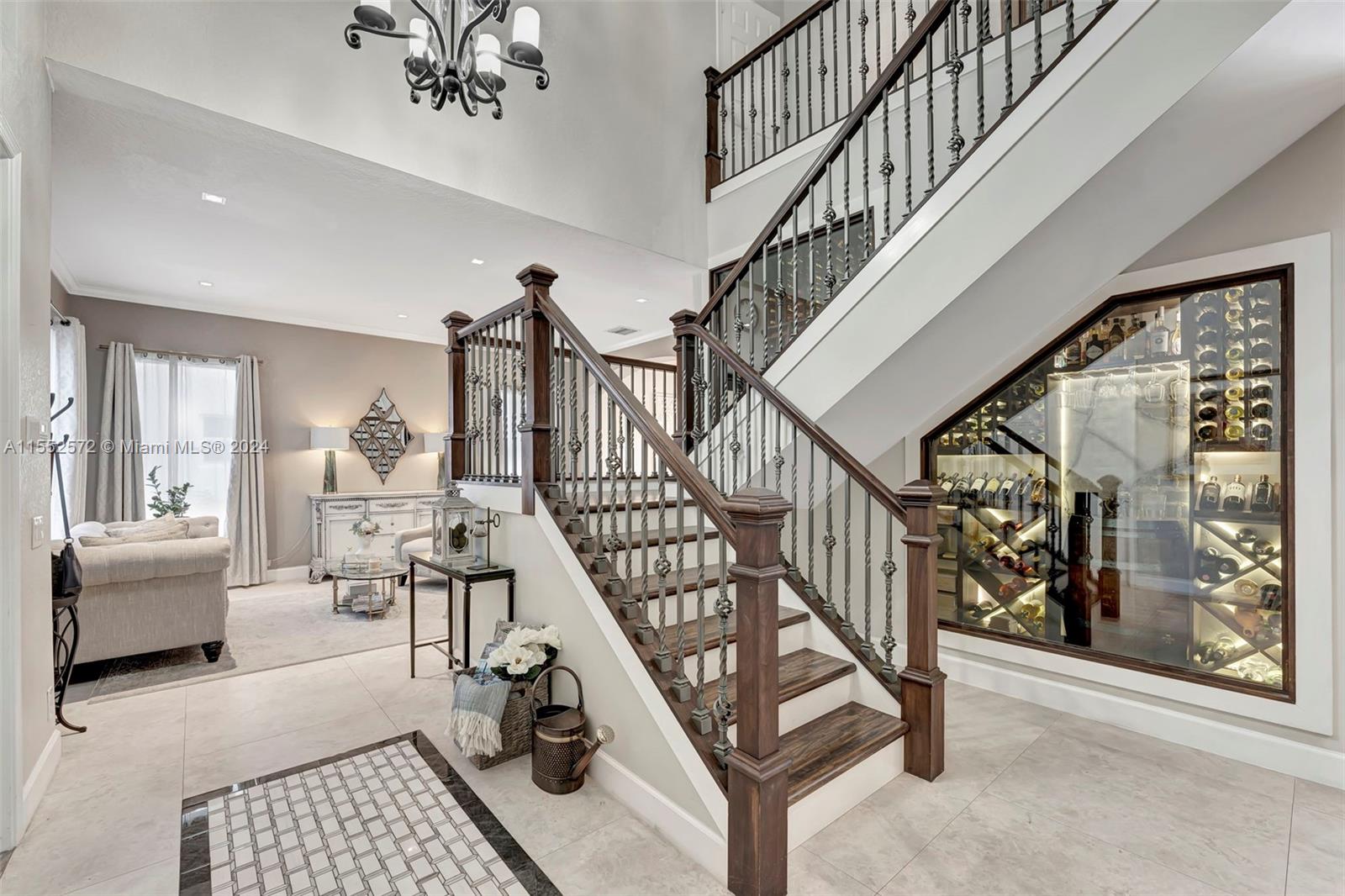 809 Regal Cove Road Weston, FL 33327 - Photo 47 of 70 a view of entryway and hall with wooden floor